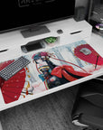 40x20 inches desk pad showing a shy anime girl glancing back in snowfall, framed by two red parasols.