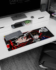 Makoto Niijima from Persona 5 on a 32x12 inch mouse pad, showcasing a fierce stance with a bold red, black, and grey design.
