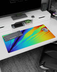 Bold 32x16 mouse pad with radiant colors of blues, greens, oranges, and yellows, adding an energetic burst of color to your workspace