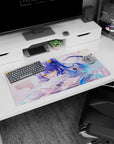 Blue-haired anime girl lounging on a fluffy pillow holding a card, star accents, mouse pad 32x16 inches.