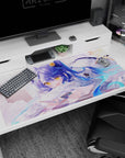 Blue-haired anime girl holding a card, lounging on a pillow with drifting stars, desk pad 40x20 inches.