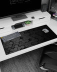Artistic 36x16 inches desk pad featuring hexagonal pattern design, with a sleek 3D honeycomb in muted black tones for a modern, refined workspace.