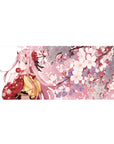 Desk pad featuring Zero Two from Darling in the Franxx, 36x16 inches, with a serene cherry blossom scene and soft pink sakura hues.