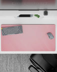 Dynamic 32x16 desk mat combines soft pink hues and gradient patterns for impactful yet soothing visuals