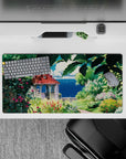 32x16 inches mouse pad showcasing a secret garden with lush greenery, blooms, and a tranquil coastal view for a serene escape.