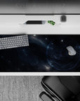 Smoky navy and cool blue-gray desk pad, 36x16 inches, calm cinematic mood with subtle star speckles.