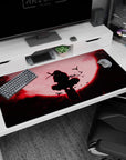 Blood-red moon and shadowy shinobi design on 40x20 desk pad ideal for fans of dark anime aesthetics