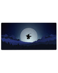 Anime mouse pad 32x16 inches featuring a lone samurai soaring against a full moon, with layered forests and jagged mountains.