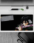 Mikasa Ackerman from Attack on Titan in battle on a 32x16 inch anime mouse pad, featuring her intense gaze and iconic cloak.