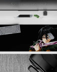 Mikasa Ackerman-themed Attack on Titan desk pad 36x16 inches with intense battle scene, deep green cloak, and violet steel.