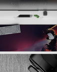 36x16 inches desk pad with Guts in his Berserker Armor against a dramatic sky, ideal for transforming your desk with the raw power and emotional intensity of the Black Swordsman.