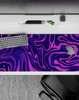 36x16 inches mouse pad with purple swirl abstract design, blending deep purples and vibrant pinks for a lively, motion-filled desk aesthetic.