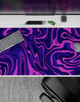 40x20 inches mouse pad with purple swirl abstract design, blending deep purples and vibrant pinks for a creative, dynamic desk aesthetic.