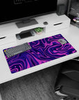 Modern 32x16 inches mouse pad featuring purple swirl abstract design, with deep purples and vibrant pinks for a motion-filled, bold desk aesthetic.