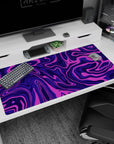 Large 40x20 inches mouse pad featuring purple swirl abstract design, with vibrant pinks and deep purples for a bold and motion-filled workspace look.