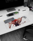 28x12 inches anime girl desk mat showing a red-haired heroine sweeping a staff with an intense stare.