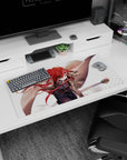 Anime girl mouse pad 32x16 inches showing a focused heroine swinging a staff, red hair ribbons flying.