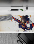 Cinematic anime desk pad 36x16 inches in black and orange with warm sparks, bold high-speed vibe.