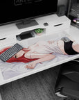 Red-haired, golden-eyed anime girl on pale gray bed desk pad 40x20 inches, white camisole scene.