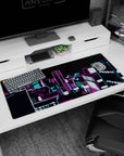 36x16 inches anime desk pad showing a glowing neon skyline spilling across the desk like an anime intro.