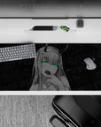 Striking 36x16 desk pad highlights Zero Two's neon green eyes and smirk with a dark, mysterious vibe