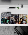 Gritty 32x12 inch anime mouse pad featuring Tanjiro, Inosuke, and Zenitsu from Demon Slayer in dynamic, sketch-style action.