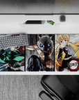Anime desk pad 36x16 inches featuring Tanjiro, Inosuke, and Zenitsu in a dynamic sketch-style scene from Demon Slayer.