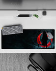 Intense 32x12 mouse pad channels Itachi's enigmatic spirit through a vivid blood-red moon design for fans