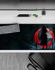 Dark and enigmatic 36x16 desk pad highlights Itachi's complex legacy against a chilling blood-red sky backdrop