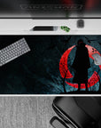 Mysterious Itachi-themed 40x20 desk pad with striking red moon design perfect for showcasing tragic character vibes