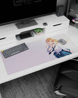 Playful finger-to-lips anime schoolgirl desk pad 36x16 inches, blonde with violet eyes in uniform.