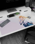 Flirty blonde anime schoolgirl desk pad 40x20 inches, finger-to-lips pose, hair in breeze on pastel.