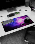 Two floating planets in a starry nebula scene mouse pad 32x16 inches with soft pink cloud accents.