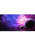 Galaxy desk pad 36x16 inches with star-speckled nebula gradient and two shadowy planets.
