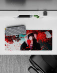 28x12 inches mouse pad showcasing Itachi Uchiha, beneath red petals, offering a blend of beauty, serenity, and strength.