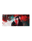 Mouse pad featuring Itachi Uchiha, 28x12 inches, with red petals around him, symbolizing his strength and complexity.