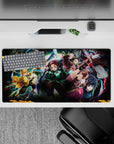 Demon Slayer anime mouse pad 32x16 inches featuring Tanjiro, Nezuko, Zenitsu, Inosuke, and Giyu in action-packed scene.