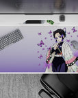 40x20 inches desk pad showcasing Shinobu Kocho surrounded by fluttering purple butterflies and soft, calming hues, perfect for anime fans.