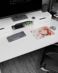 14x10 inches anime girl mouse pad showing a winking blonde with long hair, bracelets, and sparkly piercings.