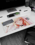 Winking blonde anime girl scene mouse pad 32x16 inches, long shiny hair, black choker, peace sign pose.