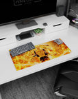 28x12 inches mouse pad showing ripped-cloth anime fighter holding a blazing orb, flames whipping behind.