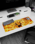 32x12 inches anime mouse pad showing a ripped-cloth fighter holding a fiery orb, weapon halo behind him.