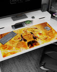 40x20 inches desk pad showing a ripped-cloth fighter holding a blazing orb, weapon arcing behind him.