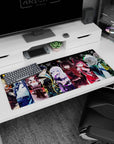 36x16 inches desk pad showing corset girl, crimson hooded girl, and cap-and-jacket anime squad staring forward.