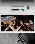 Anime girl mouse pad 32x16 inches in smoky black with crimson glow eyes and drifting red petals, cinematic.