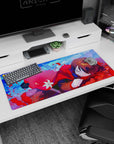 Cozy anime girl curled up in a red hood, brown hair and sleepy eyes on a 36x16 inches desk pad.