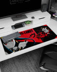 Yor Forger SPY x FAMILY desk pad 36x16 inches, gloved hand holding golden stiletto in closeup.