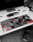 Persona 5 desk pad 36x16 inches, featuring Phantom Thieves' masks in bold lines and shadows with red swirls.