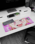 32x12 inches anime girl mouse pad showing a blushing girl with heart pupils and glitter nails, grinning wide.