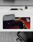 28x12 inches mouse pad with Guts in his Berserker Armor, showcasing dynamic brush strokes and a glowing eye, ideal for a powerful and intense desk setup.